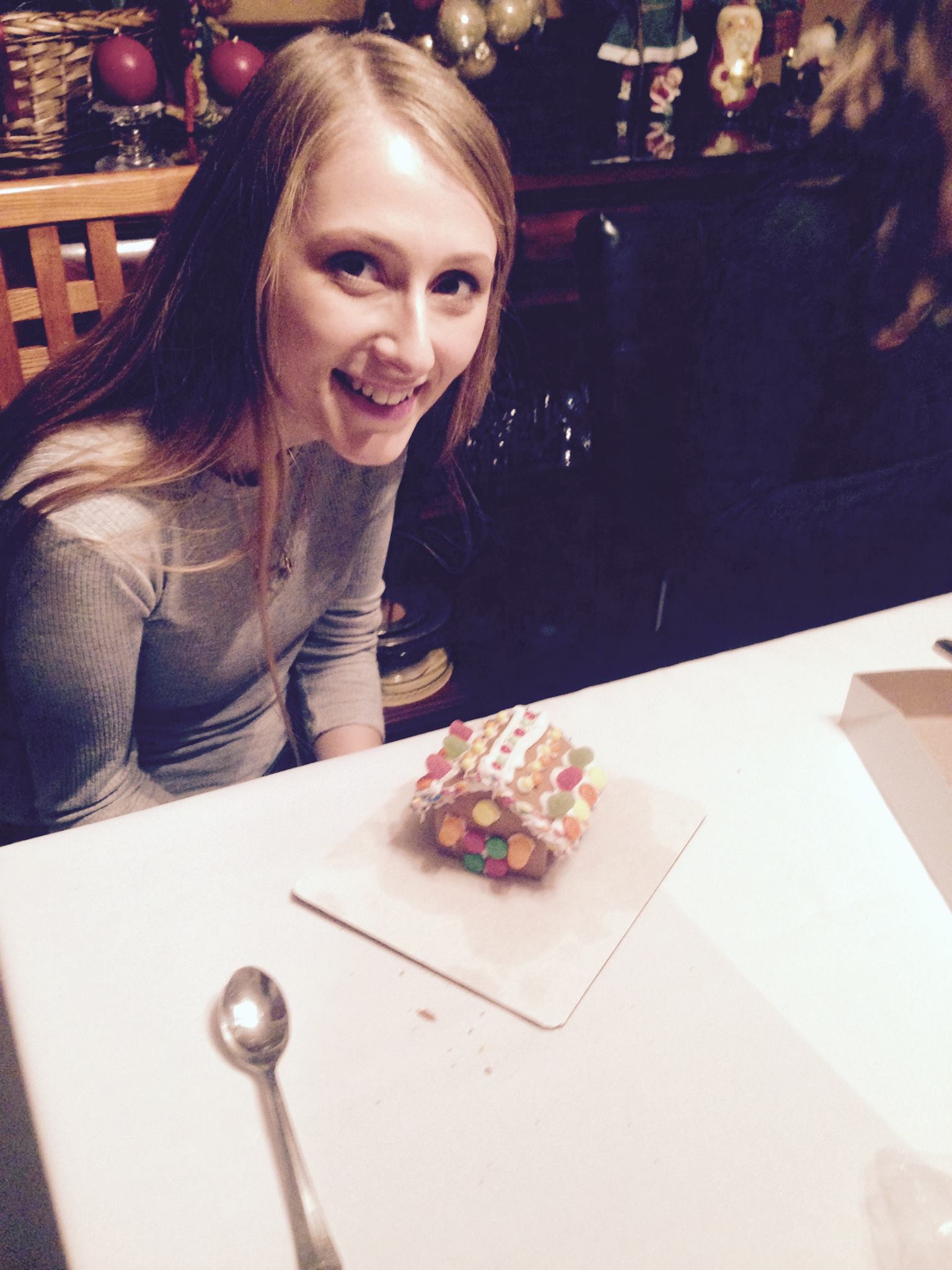 Sara Hall builds her gingerbread house at the 2016 lab holiday party.