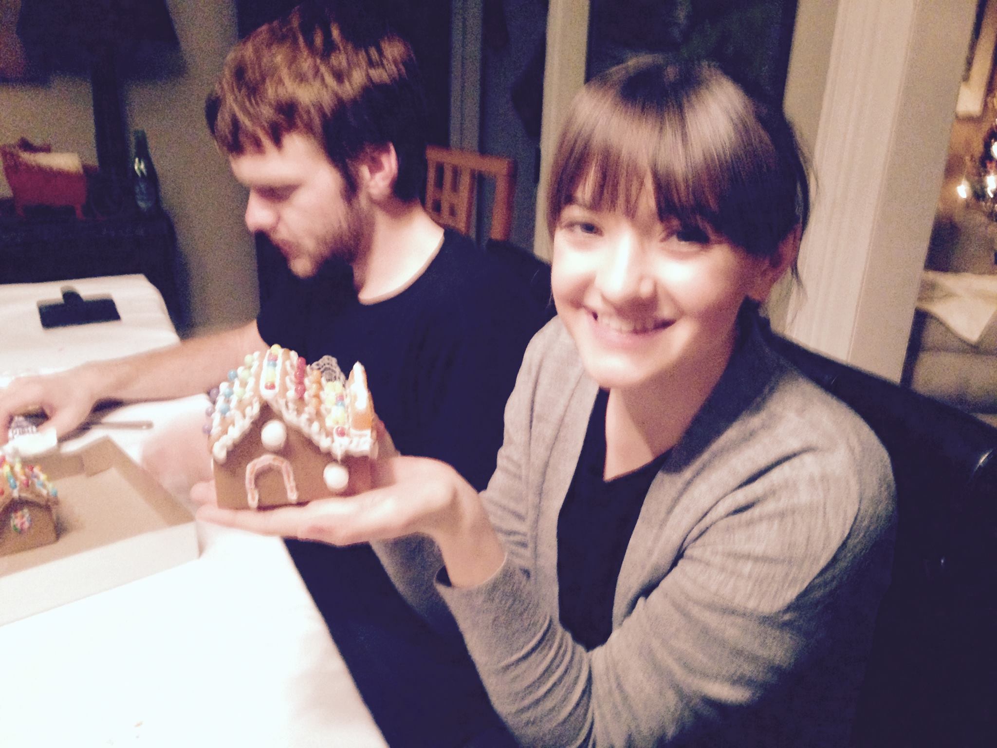 Madeline Peters and Colin Bonner working on their gingerbread houses at the 2016 lab holiday party.